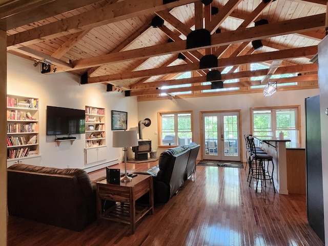 living room featuring french doors, plenty of natural light, beamed ceiling, and wooden ceiling