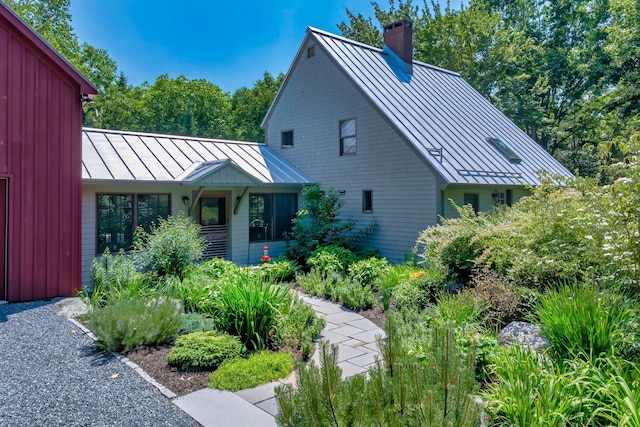 226 Graytown Rd, Sedgwick, ME 04676 - view of front of home featuring metal roof, a standing seam roof, and a chimney
