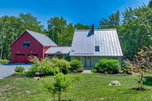 226 Graytown Rd, Sedgwick, ME 04676 - view of front of house featuring metal roof, a front yard, a standing seam roof, and driveway