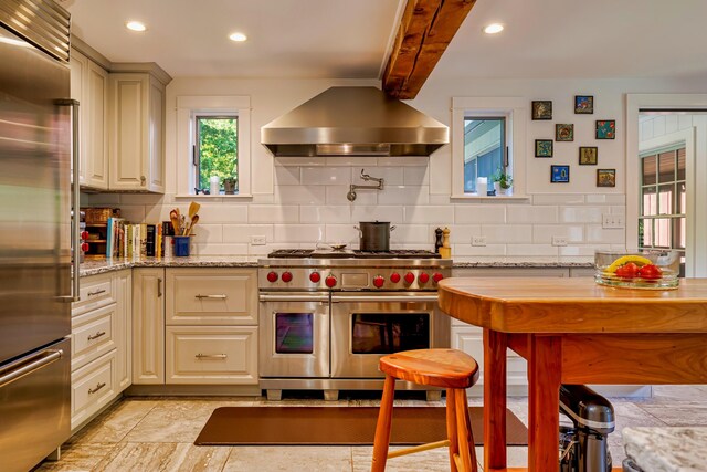 226 Graytown Rd, Sedgwick, ME 04676 - kitchen with island exhaust hood, high quality appliances, decorative backsplash, and recessed lighting