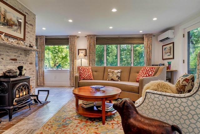 226 Graytown Rd, Sedgwick, ME 04676 - living area with a wall mounted air conditioner, a wood stove, and recessed lighting