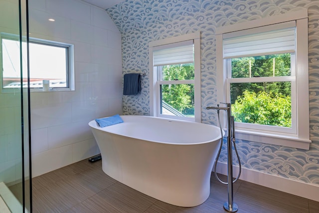 226 Graytown Rd, Sedgwick, ME 04676 - full bath with wallpapered walls, tile patterned floors, and a freestanding bath
