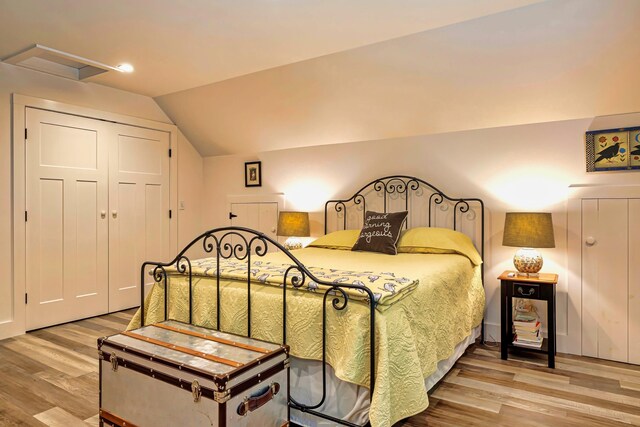 226 Graytown Rd, Sedgwick, ME 04676 - bedroom featuring a closet, lofted ceiling, wood finished floors, and attic access