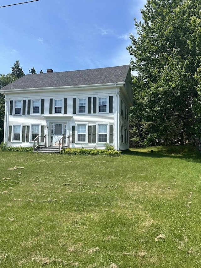 view of front of home with a front yard