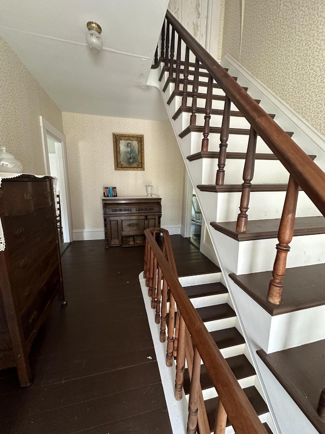 stairs featuring hardwood / wood-style flooring