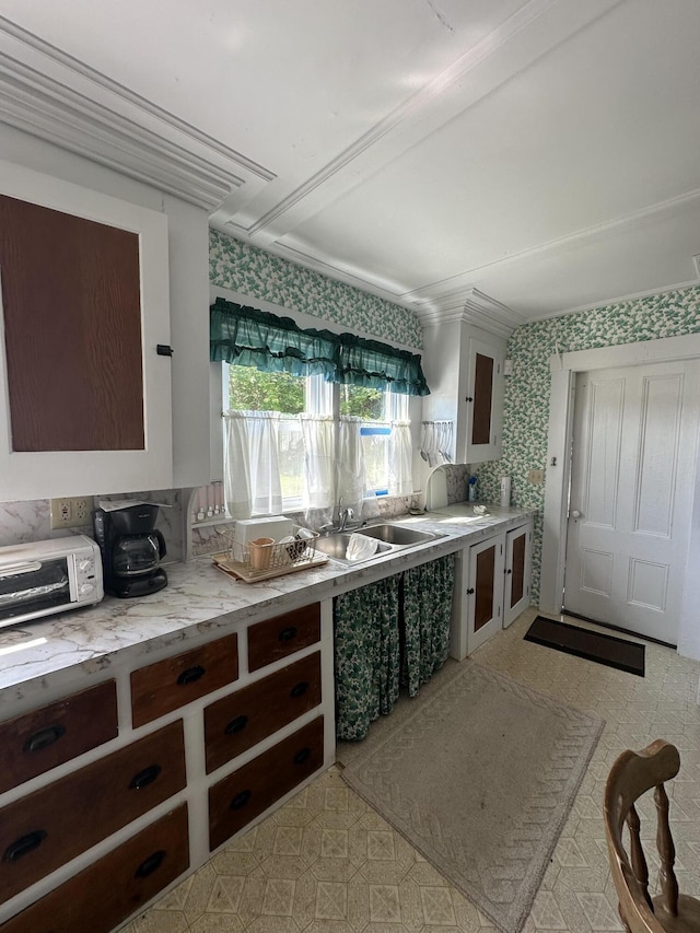 kitchen with sink and dark brown cabinets