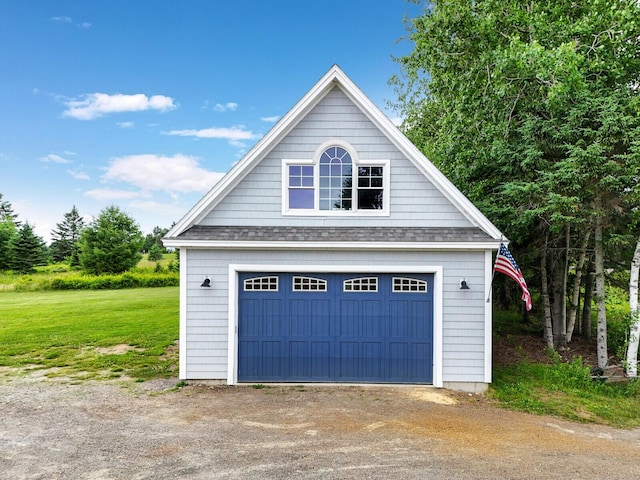 garage with a lawn