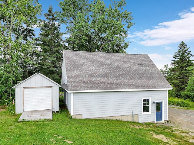 garage featuring a yard