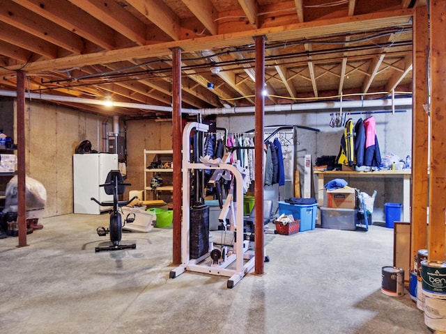 basement with white refrigerator