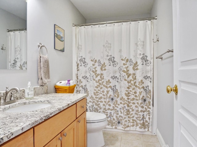 bathroom featuring tile patterned floors, curtained shower, vanity, and toilet