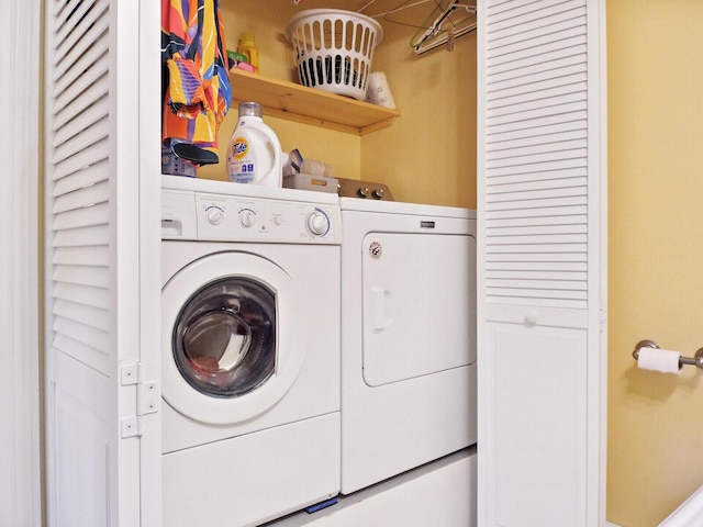 clothes washing area with independent washer and dryer