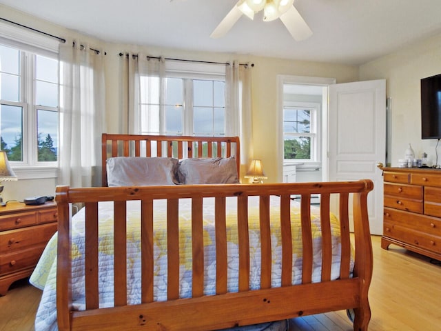 bedroom featuring ceiling fan and light hardwood / wood-style flooring