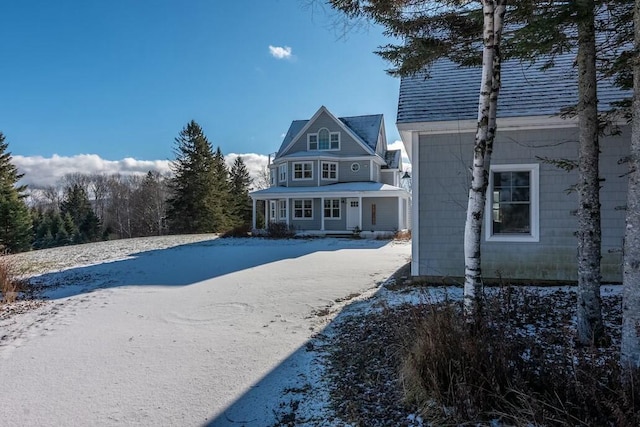 view of snow covered house