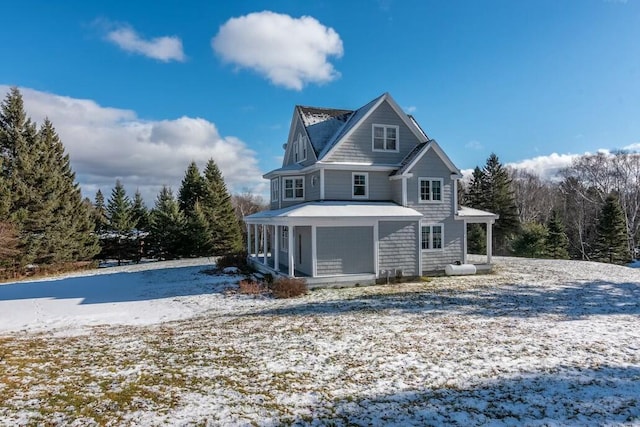 view of snow covered property