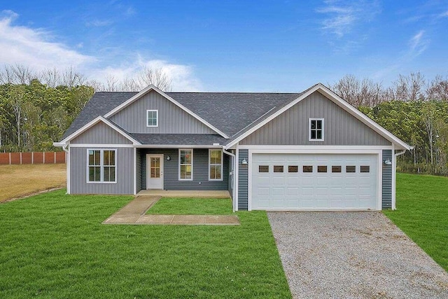 view of front of house featuring a garage and a front lawn