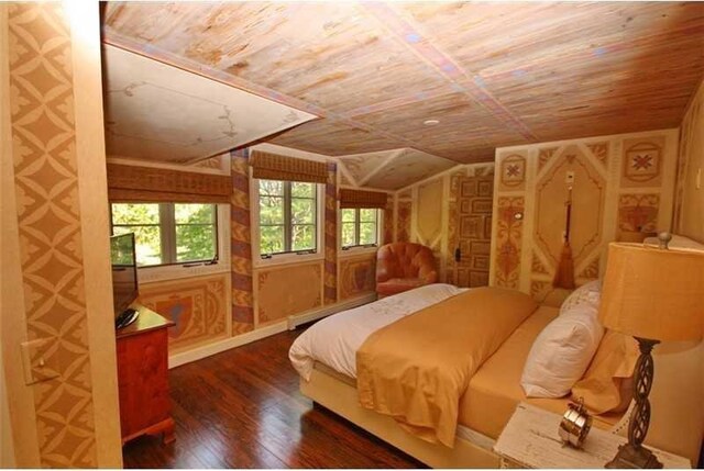 bedroom with lofted ceiling, dark wood-type flooring, and wood ceiling