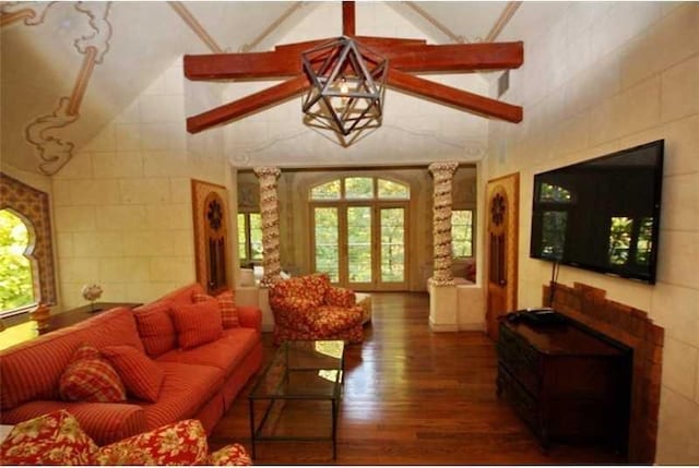 living room with beam ceiling, french doors, dark wood-type flooring, and high vaulted ceiling