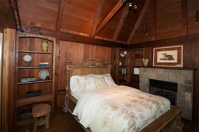 bedroom with wooden ceiling, wood walls, and vaulted ceiling with beams