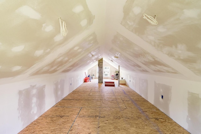 bonus room featuring vaulted ceiling