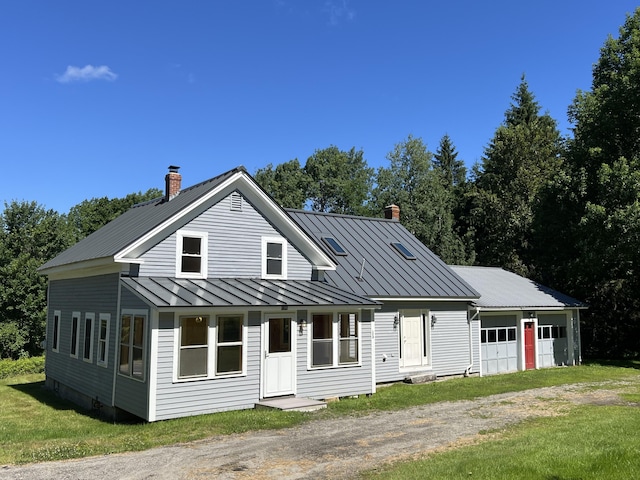 view of front of property featuring a garage and a front yard