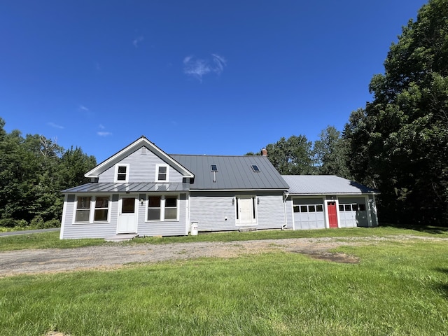 view of front of property with a garage and a front yard