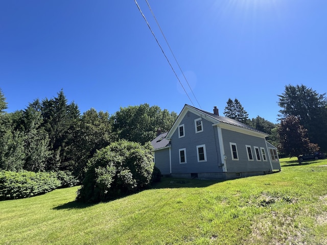 view of home's exterior featuring a lawn