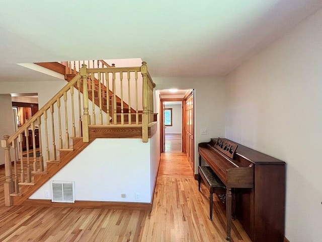 stairs featuring wood-type flooring