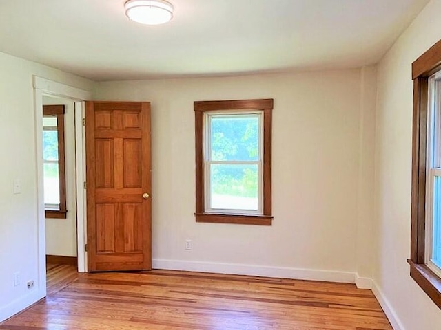 spare room with light wood-type flooring