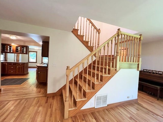 stairway featuring hardwood / wood-style flooring