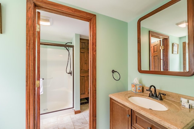 full bath featuring a stall shower and vanity