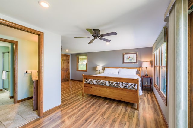 bedroom featuring light wood-style floors, recessed lighting, and baseboards