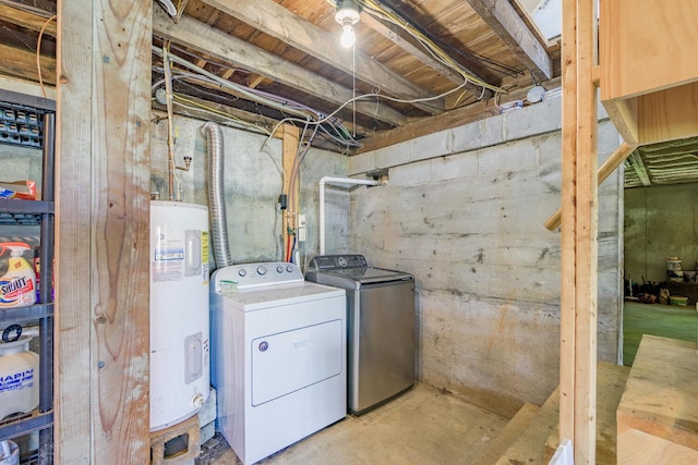 laundry room featuring laundry area, electric water heater, and separate washer and dryer