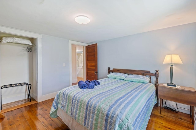 bedroom with wood-type flooring