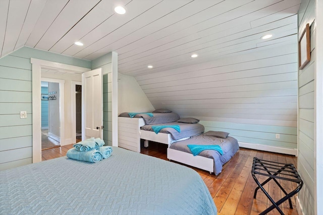 bedroom featuring wood-type flooring, wood ceiling, and vaulted ceiling