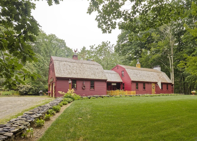 log home with a front lawn