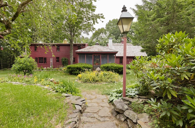 view of yard with a sunroom