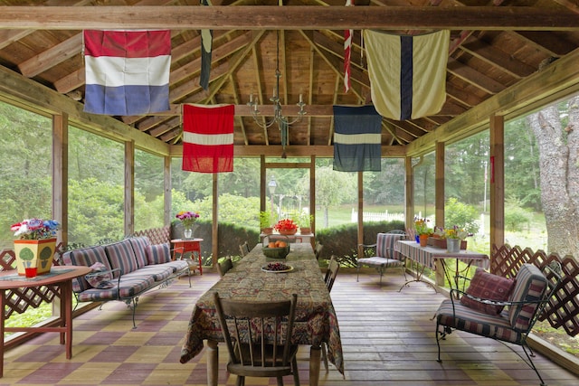 sunroom / solarium with vaulted ceiling