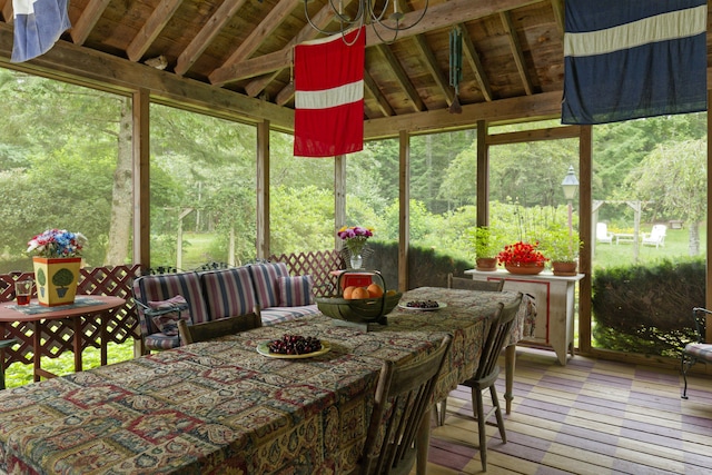 sunroom / solarium with lofted ceiling