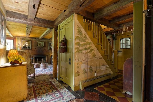 hallway with beamed ceiling, wooden ceiling, and a baseboard heating unit