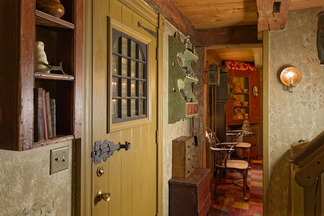 interior space with wooden ceiling and wooden walls