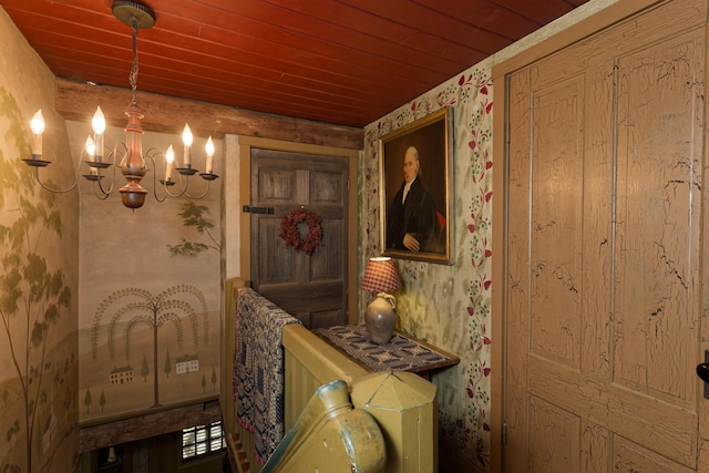 bathroom featuring wood ceiling and an inviting chandelier