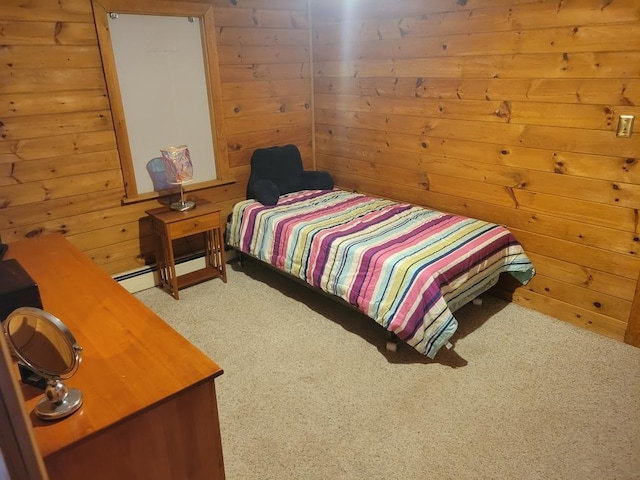 bedroom featuring light carpet and wooden walls