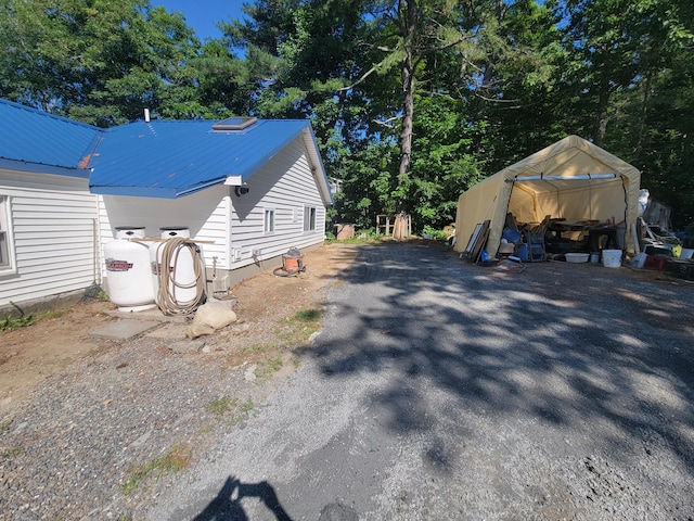 view of side of property featuring an outdoor structure