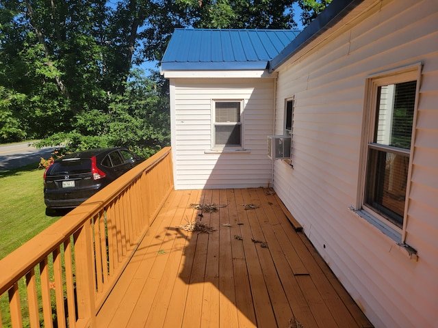 wooden terrace featuring cooling unit