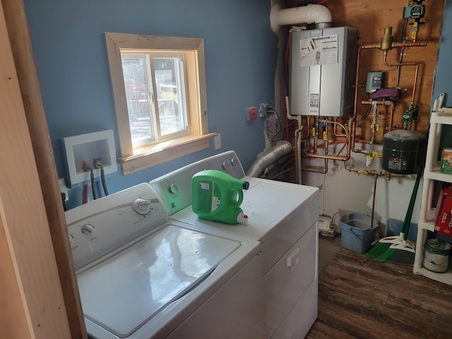 laundry room with tankless water heater, separate washer and dryer, and dark hardwood / wood-style floors