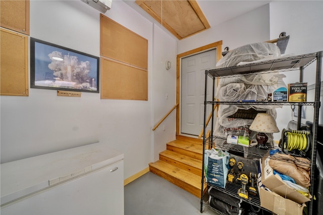 stairs featuring concrete floors