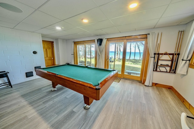 game room featuring a paneled ceiling, pool table, and hardwood / wood-style flooring