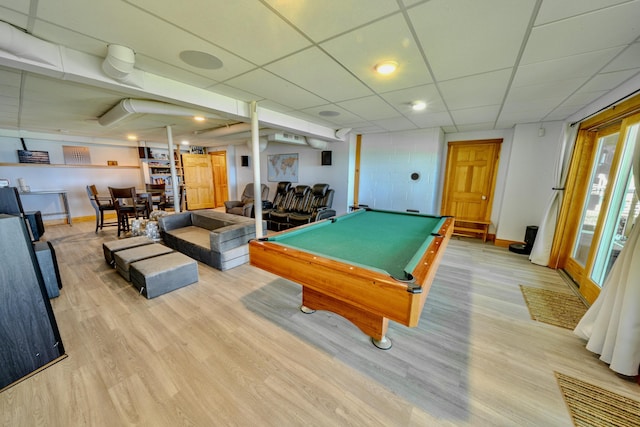 playroom with a paneled ceiling, light wood-type flooring, and pool table