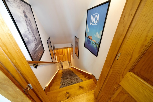 stairs featuring hardwood / wood-style floors