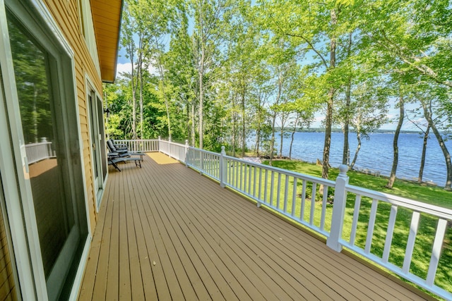 deck featuring a water view and a yard